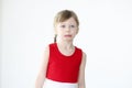 Portrait of little offended girl on white background