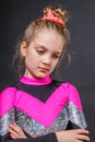 Portrait of little pensive cheerleader girl