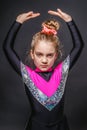 Portrait of little pensive cheerleader girl