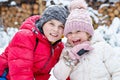 Portrait of little preschool girl and school boy playing with snow in winter. Brother and cute sister together during Royalty Free Stock Photo