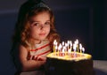 Portrait of little pretty girl with birthday cake Royalty Free Stock Photo