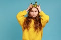 Portrait of little princess girl standing and wear golden diadem crown with smile, looking at camera