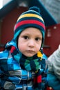 Portrait of a little sad boy standing at the playground area Royalty Free Stock Photo