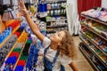 School girl choosing pen at stationery store preparing for new education year Royalty Free Stock Photo