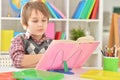 Portrait of little schoolboy doing his homework Royalty Free Stock Photo