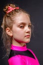 Portrait of little serious girl cheerleader