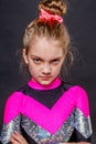 Portrait of little serious girl cheerleader