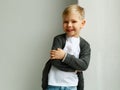 Portrait of little smiley pretty boy over white background