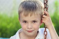 Portrait of a little smiling boy with golden blonde straw hair i Royalty Free Stock Photo