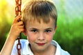 Portrait of a little smiling boy with golden blonde straw hair i Royalty Free Stock Photo