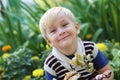 Portrait of a little smiling boy in the park