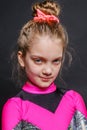 Portrait of little smiling cheerleader girl