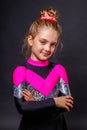 Portrait of little smiling cheerleader girl