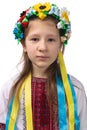 Portrait of a little Ukrainian girl with tearful eyes. Child in national dress