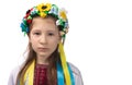 Portrait of a little Ukrainian girl with tearful eyes. Child in national dress