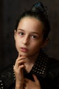 Portrait little young girl with green eyes. Young serious child looking at camera. Closeup. Indoors