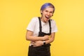 Portrait of lively joyful hipster woman holding arms on belly and laughing out loud. yellow background, studio shot