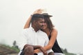 Portrait of living young couple at the beach. They are happy and smile. Concept of just married family Royalty Free Stock Photo