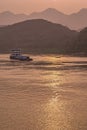 Portrait of loaded barge while sunset reflected by Yangtze River, Chongqing, China Royalty Free Stock Photo