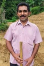 Portrait of local farmer posing on tea plantation