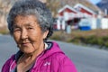 Portrait of a local inuit senior woman looking camera in Sisimiut, Greenland.