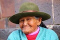 Portrait of a local woman sitting in the street of Cusco, Peru