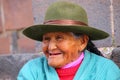 Portrait of a local woman sitting in the street of Cusco, Peru