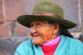 Portrait of a local woman sitting in the street of Cusco, Peru