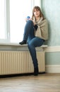Lonely Girl Sitting in Empty Room Royalty Free Stock Photo