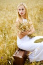 Portrait of long haired blond pretty lady in white Royalty Free Stock Photo