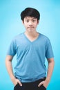Portrait of look good asian kid boy on blue background