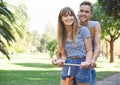 Portrait, love and couple smile on bicycle journey, outdoor wellness and romantic date in nature park. Travel