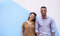 Portrait, love for fashion and black couple on wall background together with colorful space or mockup. Smile, date or