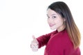 Portrait of lovely brunette woman 20s smiling and showing thumbs up isolated over white background Royalty Free Stock Photo