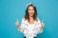 Portrait of lovely brunette woman 20s wearing headband smiling a Royalty Free Stock Photo