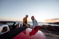 Lovely couple on the beach, traveling by car Royalty Free Stock Photo
