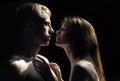 Portrait of lovely couple in love. Young sensual girlfriend glad to passionate kiss from her boyfriend. Handsome man Royalty Free Stock Photo