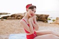 Portrait of lovely cute pin up girl in red swimsuit Royalty Free Stock Photo