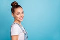 Portrait of lovely cute youth looking smiling wearing white t-shirt denim jeans isolated over blue background