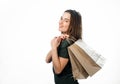 Portrait of lovely female carring shopping bags on back and looking at camera