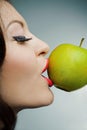 Portrait of a lovely girl with green apple Royalty Free Stock Photo