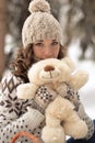 Cute,beautiful,nice girl hug a fluffy,white,beige bear Royalty Free Stock Photo