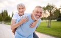 Portrait of lovely happy elderly couple on morning run outside in city park Royalty Free Stock Photo