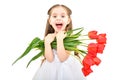 Portrait of a lovely happy girl holding a bouquet of tulips in her hands