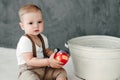 Portrait of lovely little boy happy smiling celebrating 1 year birthday. One year old european boy sitting on floor Royalty Free Stock Photo