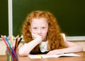 Portrait of lovely schoolgirl looking at camera