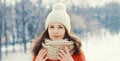 Portrait of lovely young brunette woman wearing red jacket, scarf in winter Royalty Free Stock Photo