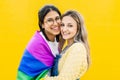 Portrait of lovely young lesbian couple hugging each other smiling at camera Royalty Free Stock Photo