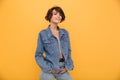 Portrait of a lovely young woman dressed in denim jacket Royalty Free Stock Photo