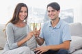 Portrait of lovers clinking their flutes of champagne Royalty Free Stock Photo